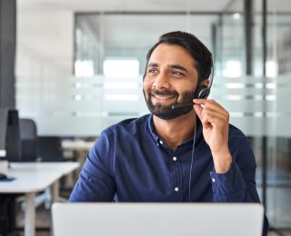 Smiling,Happy,Indian,Call,Center,Agent,Wearing,Headset,Talking,To