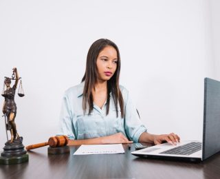 african-american-woman-using-laptop-table-with-document-figure_23-2148042617